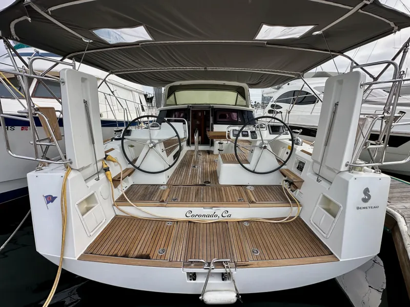 Slide: The Image of 2012 Beneteau Sense 43 yacht with dual steering wheels, docked in Coronado, California. - 7