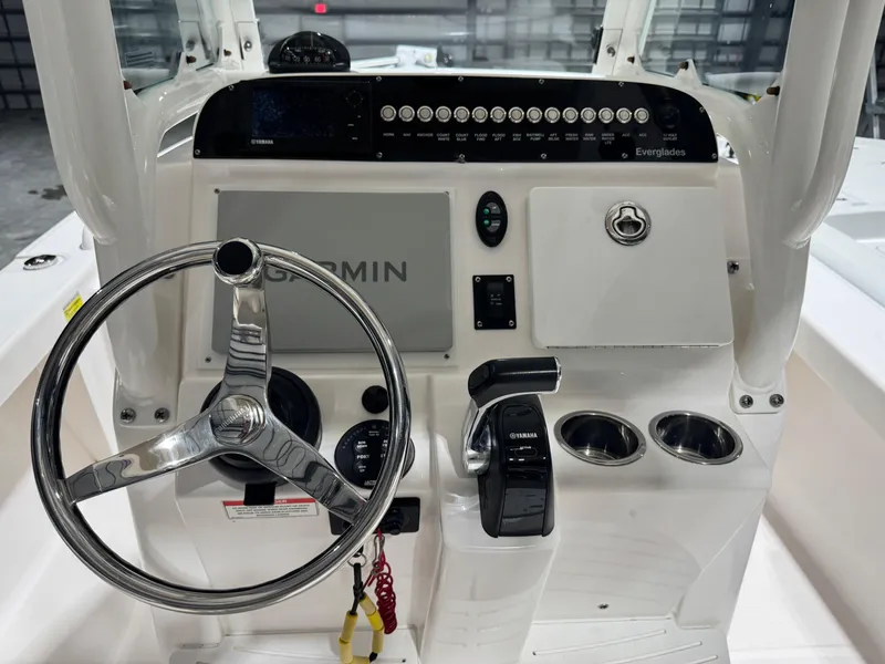 Slide: The Image of 2014 Everglades 243 CC boat console with Garmin display and Yamaha controls. - 10