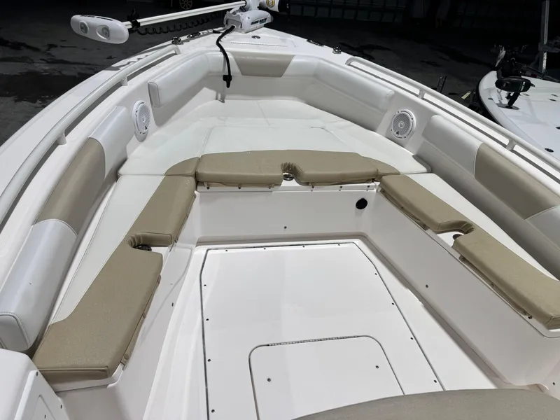 Slide: The Image of 2014 Everglades 243 CC boat interior with cushioned seating and speakers. - 12