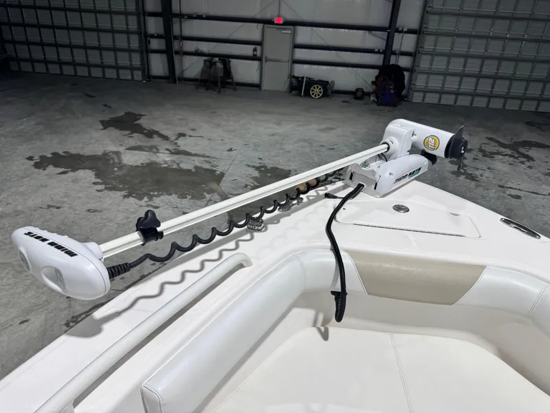 Slide: The Image of 2014 Everglades 243 CC boat with Minn Kota trolling motor in a garage. - 13