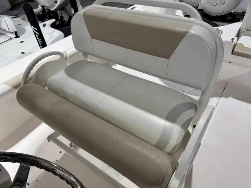 Slide: The Image of 2014 Everglades 243 CC boat seat with beige and white upholstery. - 16