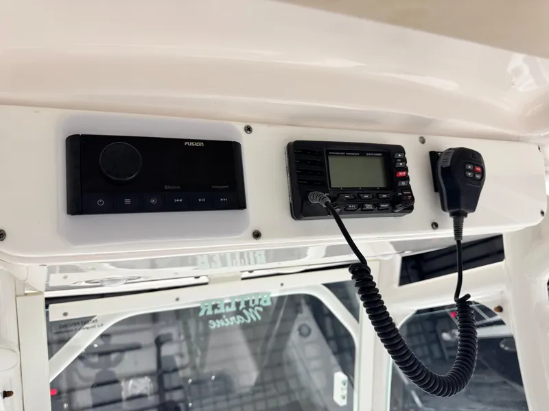 Slide: The Image of Control panel of a 2014 Everglades 243 CC boat with radio and Bluetooth system. - 17