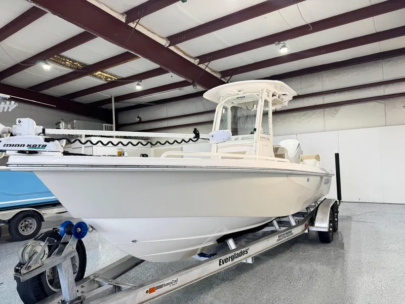 Slide: The Image of 2014 Everglades 243 CC boat on trailer in indoor storage facility. - 3