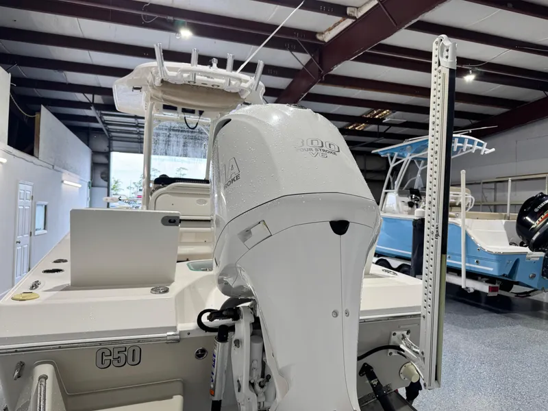 Slide: The Image of 2014 Everglades 243 CC boat with Yamaha 300 V6 engine in showroom. - 5