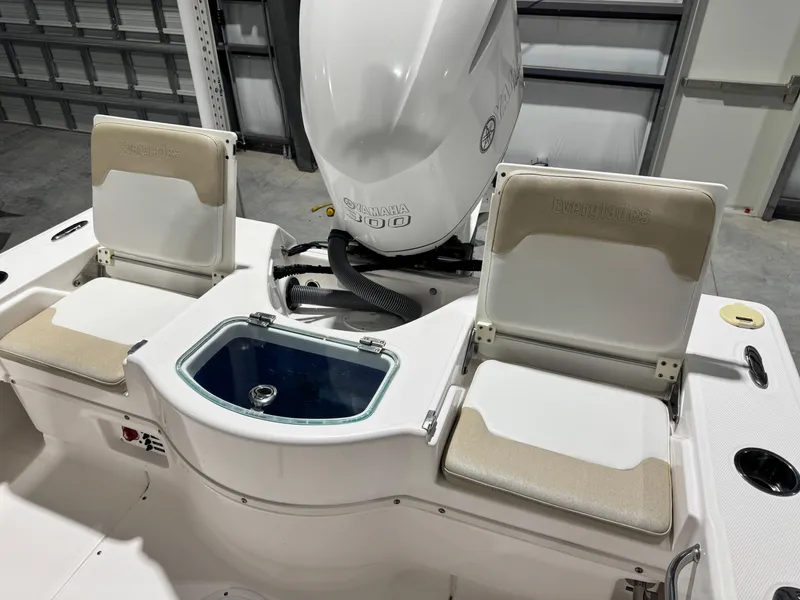Slide: The Image of 2014 Everglades 243 CC boat interior with Yamaha engine and seating. - 9