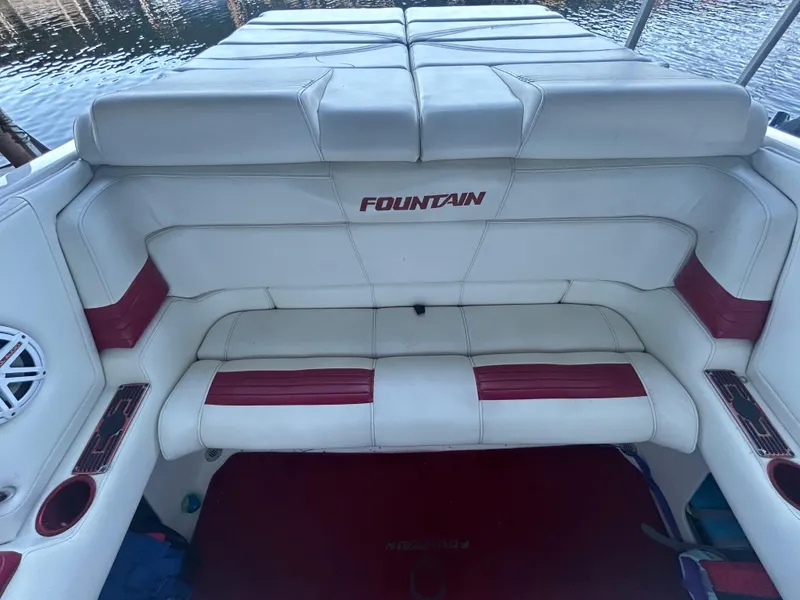 Slide: The Image of 2005 Fountain 42 Executioner boat interior with white and red seating. - 15