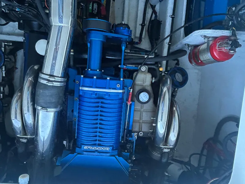 Slide: The Image of Engine compartment of a 2005 Fountain 42 Executioner boat, featuring a Whipple supercharger. - 17