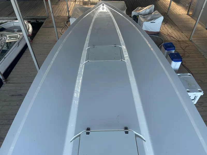 Slide: The Image of 2005 Fountain 42 Executioner boat docked, top view of sleek white deck. - 5