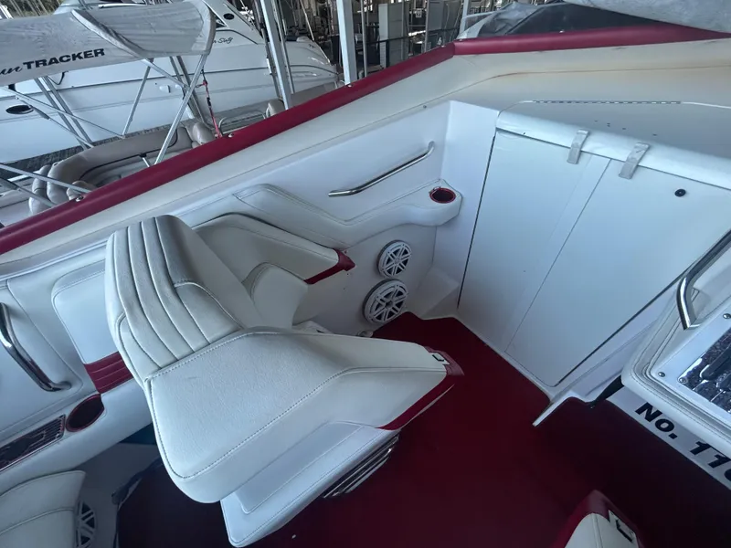 Slide: The Image of Interior of a 2005 Fountain 42 Executioner boat with white and red seating. - 9