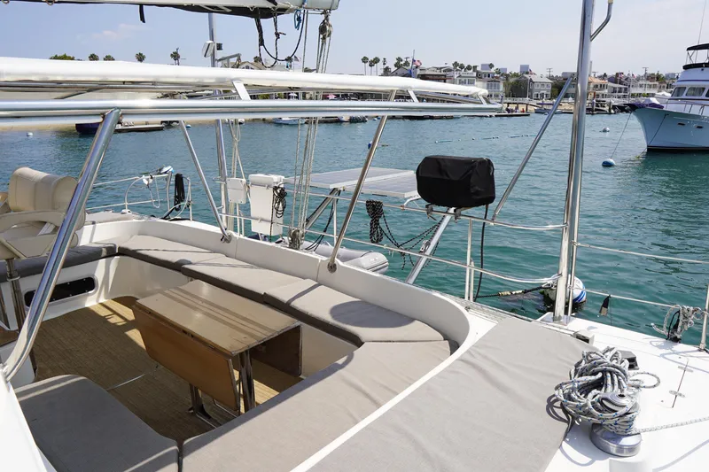 Slide: The Image of Spacious deck of 1995 Fountaine Pajot Venezia 42 catamaran in a sunny marina. - 13