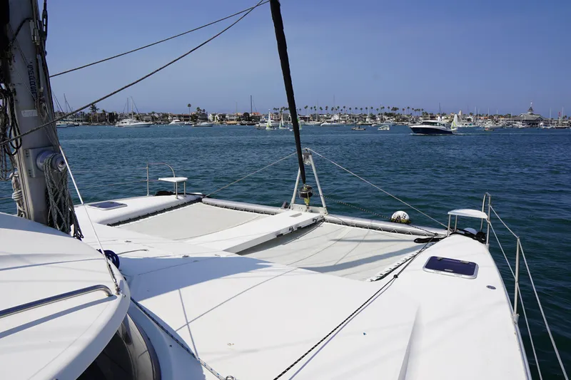 Slide: The Image of Fountaine Pajot Venezia 42 catamaran sailing in a busy harbor, 1995 model. - 14