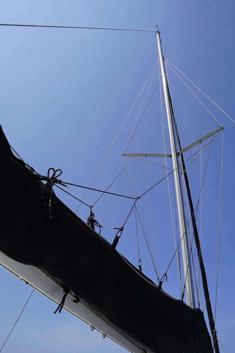 Slide: The Image of Sailboat mast and rigging of 1995 Fountaine Pajot Venezia 42 against clear blue sky. - 17