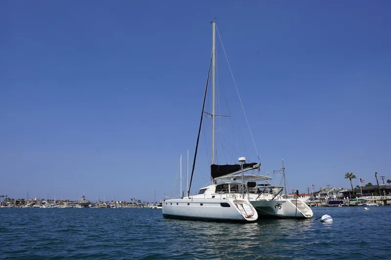 Slide: The Image of Sailing catamaran Fountaine Pajot Venezia 42, 1995, anchored in a sunny harbor. - 2