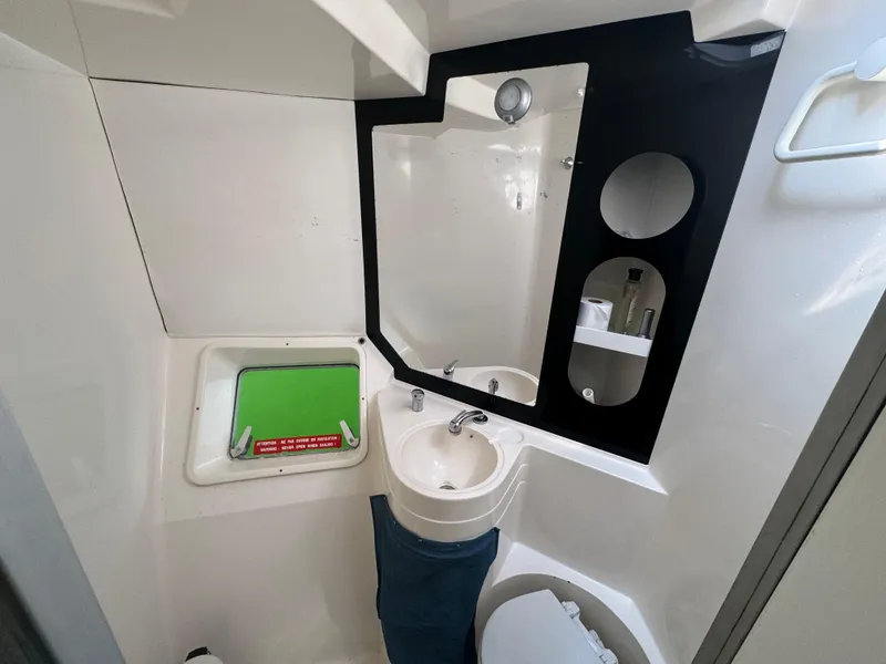 Slide: The Image of Bathroom interior of 1995 Fountaine Pajot Venezia 42 catamaran, featuring sink and mirror. - 21