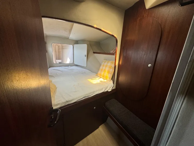 Slide: The Image of Cabin interior of 1995 Fountaine Pajot Venezia 42 catamaran with cozy bed and wooden finish. - 28