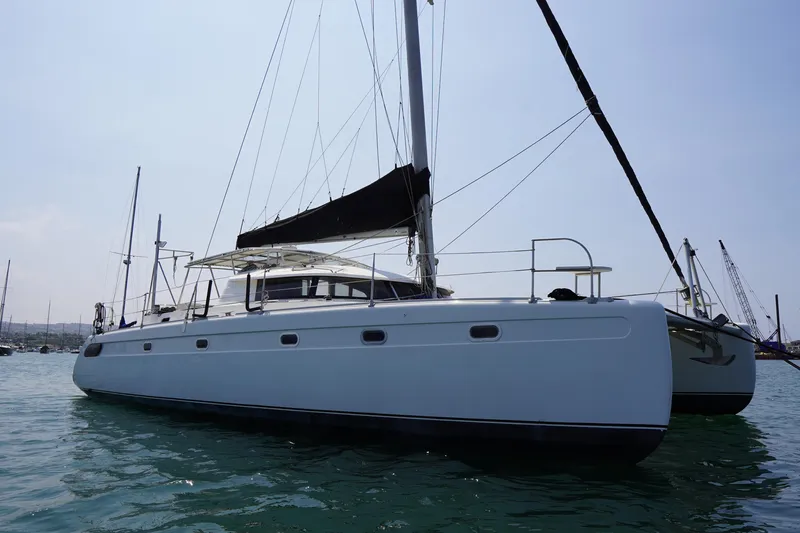 Slide: The Image of 1995 Fountaine Pajot Venezia 42 catamaran sailing on calm waters. - 4