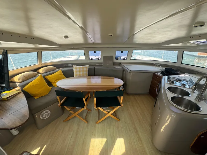 Slide: The Image of Interior of 1995 Fountaine Pajot Venezia 42 catamaran with cozy seating and modern kitchen. - 7