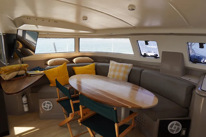 Slide: The Image of Interior of 1995 Fountaine Pajot Venezia 42 catamaran with cozy seating and ocean view. - 8