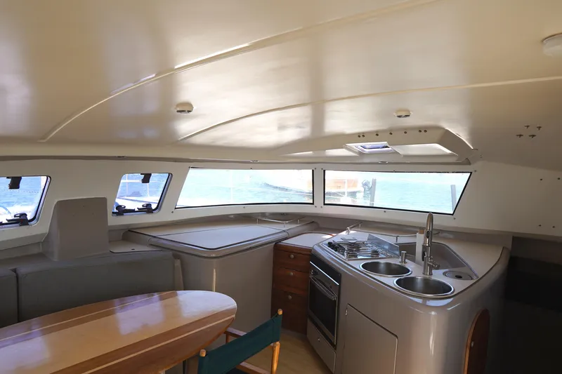 Slide: The Image of Interior of 1995 Fountaine Pajot Venezia 42 catamaran with kitchen and dining area. - 9