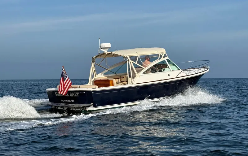 The Image of 2009 Hunt Yachts Harrier 29 cruising with American flag, named "Summer Salt". - 0