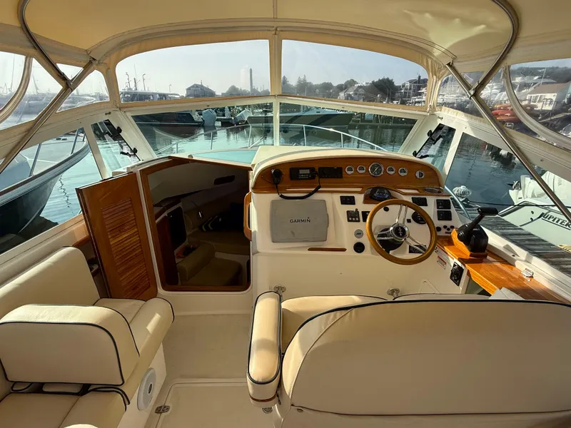 Slide: The Image of 2009 Hunt Yachts Harrier 29 interior with helm, steering wheel, and navigation equipment. - 23
