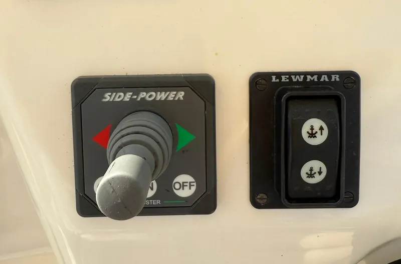 Slide: The Image of Control panel of a 2009 Hunt Yachts Harrier 29 with Side-Power and Lewmar switches. - 26