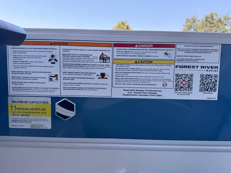 Slide: The Image of 2025 South Bay 222 LE boat warning labels and capacity information, featuring Forest River Marine branding. - 21