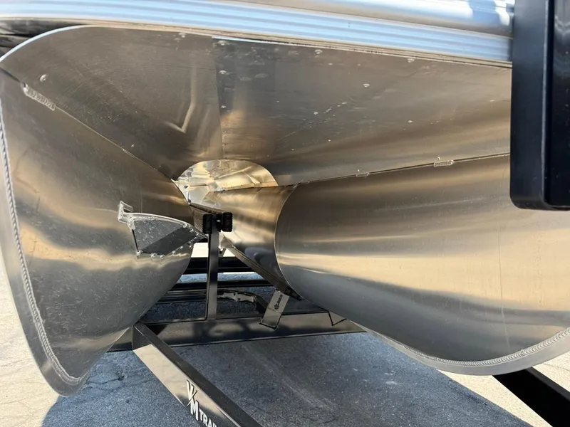 Slide: The Image of Close-up of 2025 South Bay 222 LE pontoon boat underside on trailer. - 26