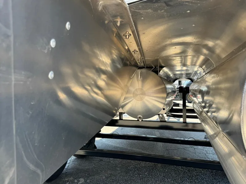 Slide: The Image of Underneath view of 2025 South Bay 222 LE pontoon boat, showcasing aluminum structure and design. - 29