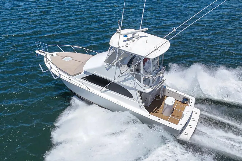 Slide: The Image of 2009 Egg Harbor 37 SportYacht cruising on open water, showcasing sleek design and performance. - 11