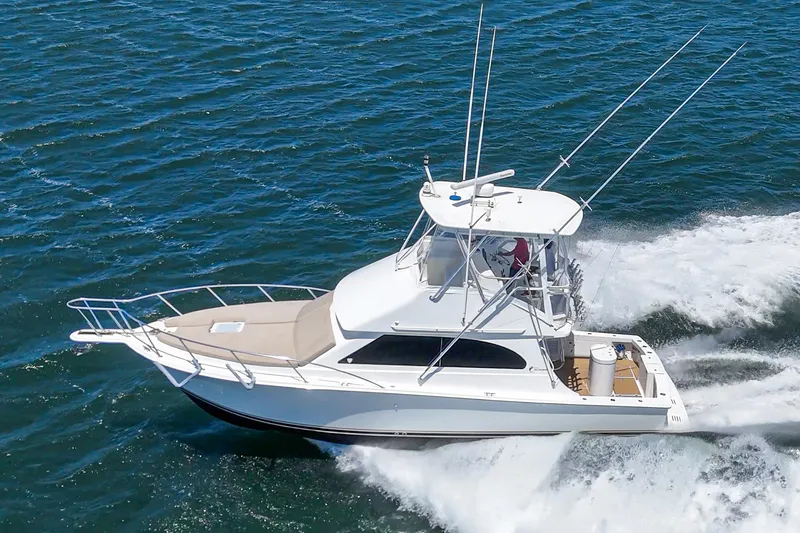 Slide: The Image of 2009 Egg Harbor 37 SportYacht cruising on open water, showcasing sleek design and performance. - 12