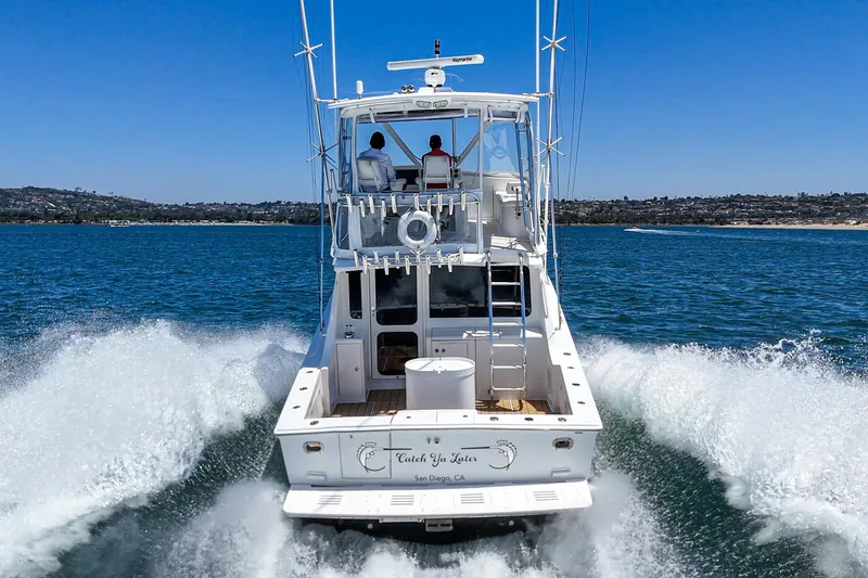 Slide: The Image of 2009 Egg Harbor 37 SportYacht cruising on open water, rear view. - 16