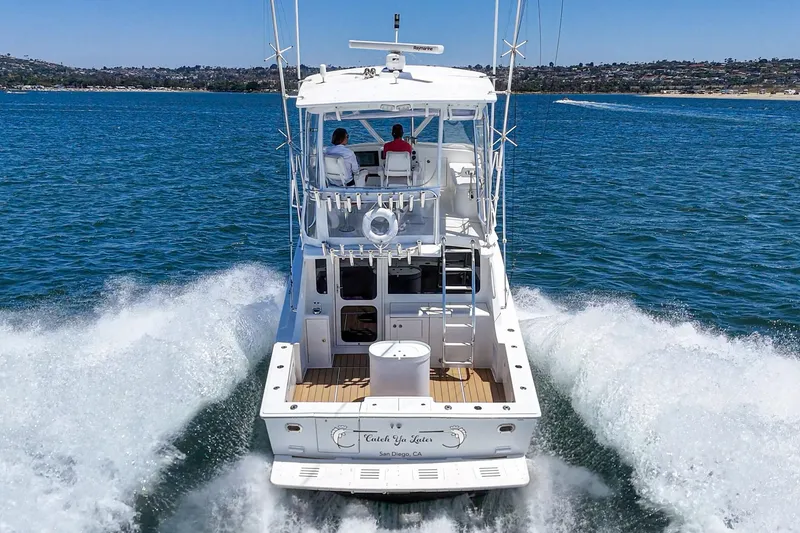 Slide: The Image of 2009 Egg Harbor 37 SportYacht cruising on open water, rear view. - 17