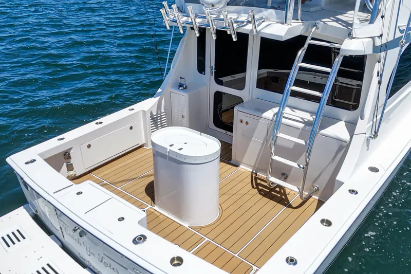 Slide: The Image of Egg Harbor 37 SportYacht 2009, spacious deck with ladder, on calm blue water. - 18