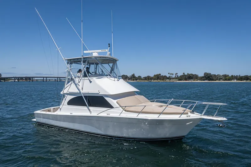 Slide: The Image of 2009 Egg Harbor 37 SportYacht on calm water under clear blue sky. - 2