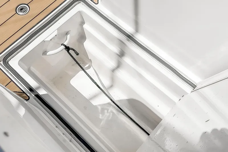 Slide: The Image of Storage compartment on 2009 Egg Harbor 37 SportYacht with rope and wooden deck detail. - 23