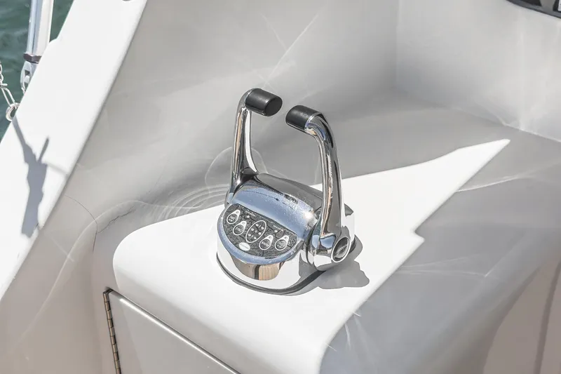 Slide: The Image of Chrome throttle controls on 2009 Egg Harbor 37 SportYacht, gleaming in sunlight. - 25