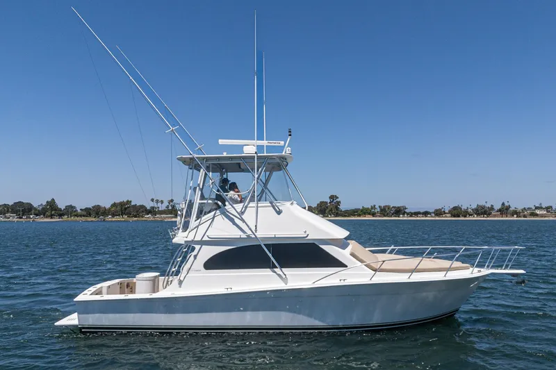 Slide: The Image of 2009 Egg Harbor 37 SportYacht on calm water under clear blue sky. - 3