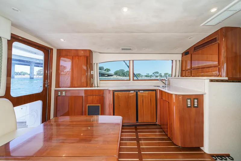Slide: The Image of Luxurious interior of 2009 Egg Harbor 37 SportYacht with wooden cabinetry and scenic window view. - 35