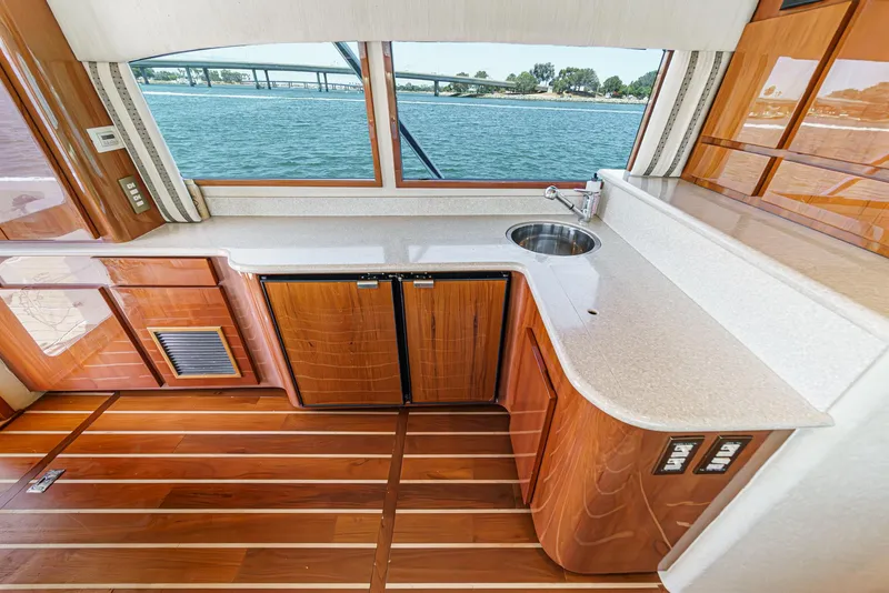 Slide: The Image of Luxurious interior of 2009 Egg Harbor 37 SportYacht with wood flooring and waterfront view. - 36