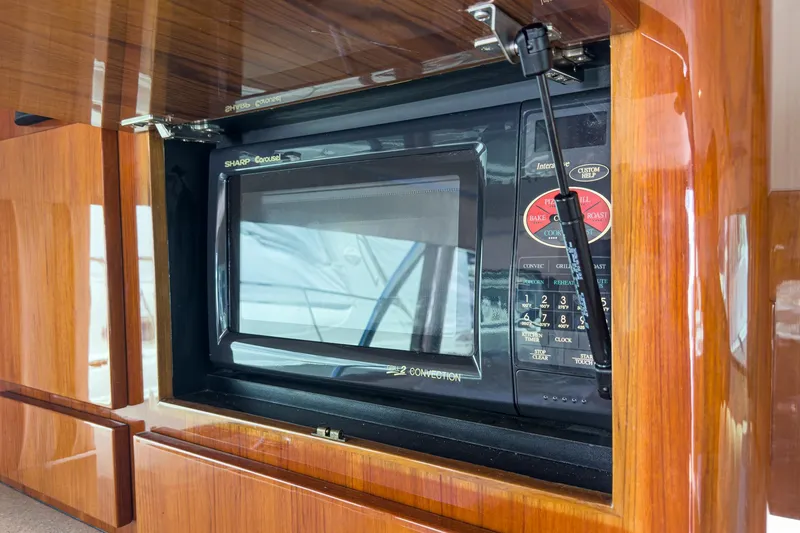 Slide: The Image of Microwave in 2009 Egg Harbor 37 SportYacht's wooden interior kitchen. - 37