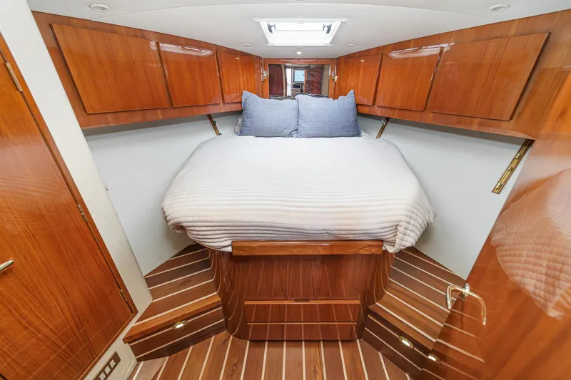 Slide: The Image of Luxurious cabin interior of 2009 Egg Harbor 37 SportYacht with wood finish and cozy bed. - 41