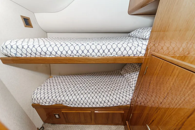 Slide: The Image of Bunk beds in 2009 Egg Harbor 37 SportYacht cabin with patterned bedding. - 47