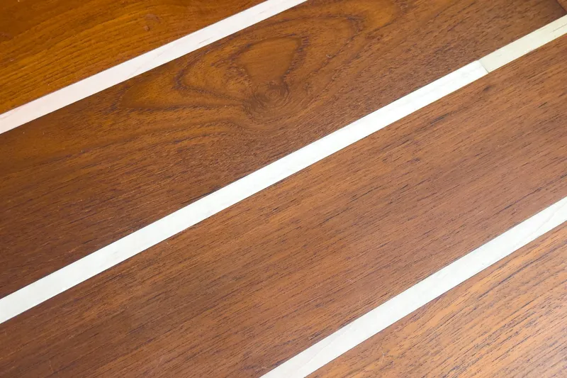 Slide: The Image of Teak deck of 2009 Egg Harbor 37 SportYacht, featuring polished wood finish. - 48