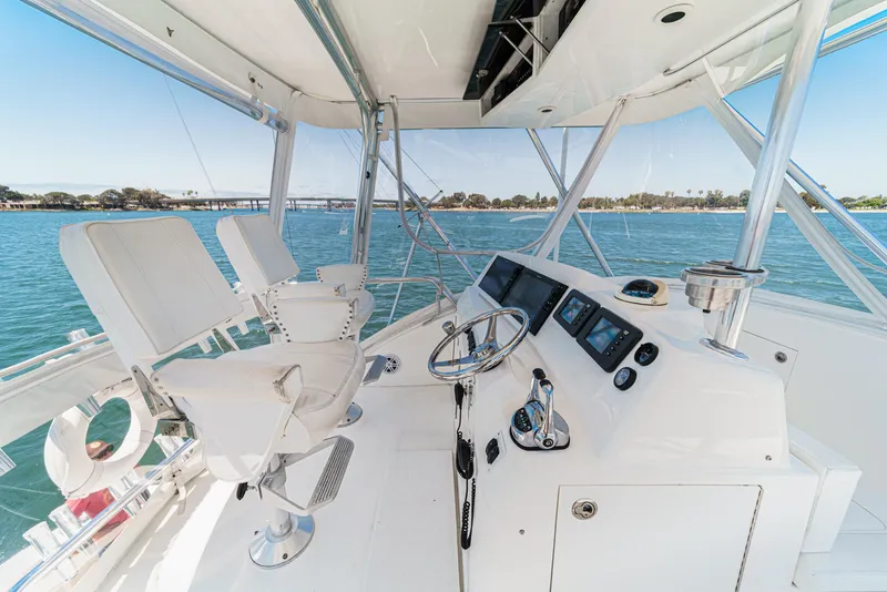 Slide: The Image of 2009 Egg Harbor 37 SportYacht helm with modern controls and ocean view. - 49