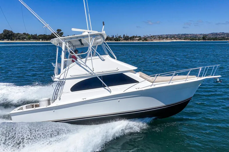 Slide: The Image of 2009 Egg Harbor 37 SportYacht cruising on blue ocean waters. - 7