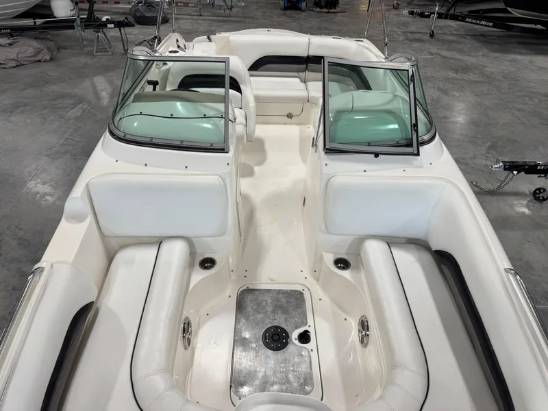 Slide: The Image of 2011 Hurricane SD217 boat interior with white seating and steering console. - 7