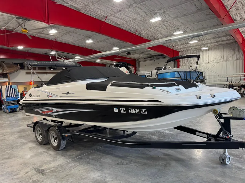 Slide: The Image of 2011 Hurricane SD217 boat on trailer in indoor storage facility. - 9