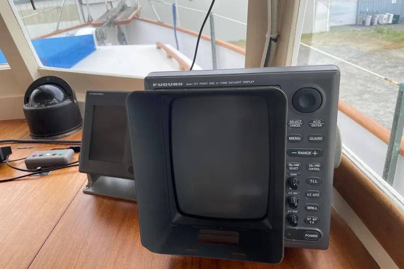 Slide: The Image of Furuno navigation equipment on 1964 Grand Banks 42 Classic yacht dashboard. - 19