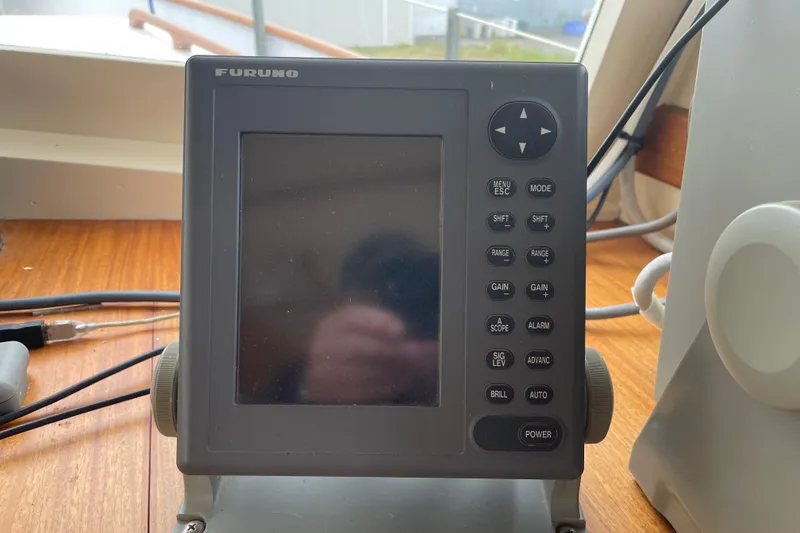 Slide: The Image of Furuno marine navigation device on 1964 Grand Banks 42 Classic boat dashboard. - 20